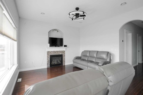 147 Killdeer, Fort Mcmurray, AB - Indoor Photo Showing Living Room With Fireplace