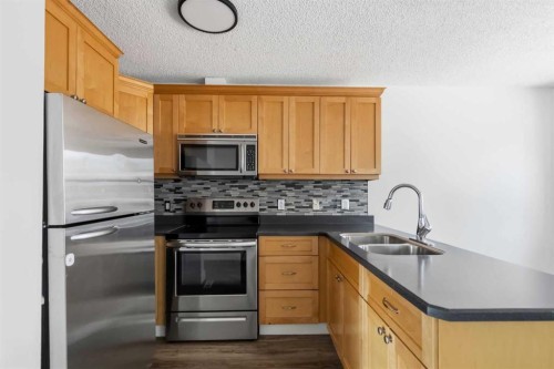 188 Windsor Drive, Fort Mcmurray, AB - Indoor Photo Showing Kitchen With Double Sink