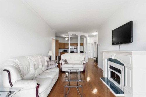 406-253 Gregoire Drive, Fort Mcmurray, AB - Indoor Photo Showing Living Room With Fireplace