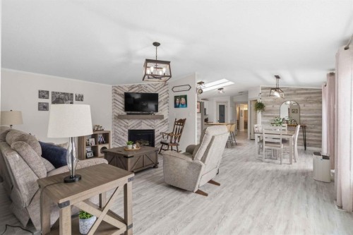 105 Sumac Crescent, Fort Mcmurray, AB - Indoor Photo Showing Living Room With Fireplace