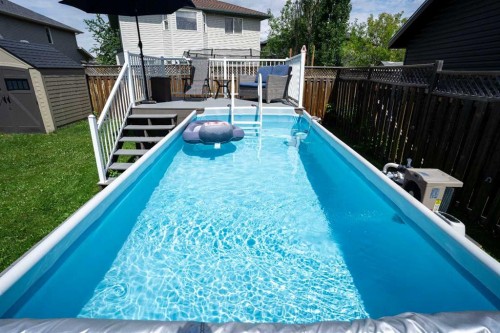 213 Parry Crescent, Fort Mcmurray, AB - Outdoor With Above Ground Pool With Deck Patio Veranda With Exterior