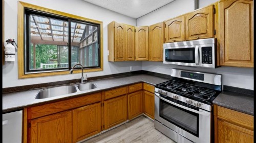 245 Bacon Place, Fort Mcmurray, AB - Indoor Photo Showing Kitchen With Double Sink