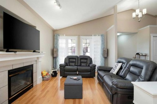 168 Lightbown Way, Fort Mcmurray, AB - Indoor Photo Showing Living Room With Fireplace