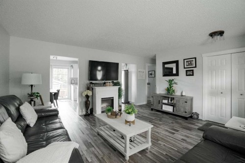 114 Hilltop Crescent, Fort Mcmurray, AB - Indoor Photo Showing Living Room With Fireplace
