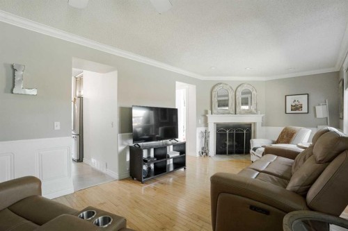 108 Norbasca Bay, Fort Mcmurray, AB - Indoor Photo Showing Living Room With Fireplace