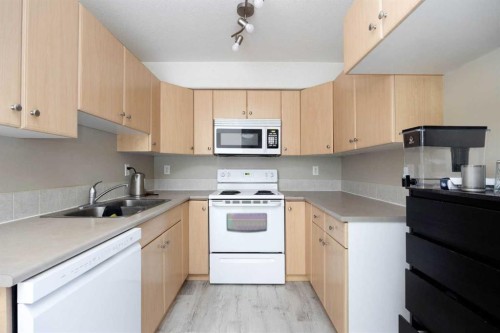 2302-200 Lougheed Drive, Fort Mcmurray, AB - Indoor Photo Showing Kitchen With Double Sink