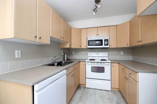 2302-200 Lougheed Drive, Fort Mcmurray, AB - Indoor Photo Showing Kitchen With Double Sink