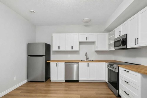 229 Heritage Drive, Fort Mcmurray, AB - Indoor Photo Showing Kitchen With Stainless Steel Kitchen With Double Sink