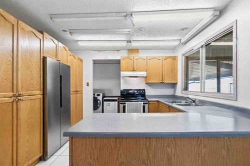 25 Crescent Heights, Fort Mcmurray, AB - Indoor Photo Showing Kitchen With Double Sink