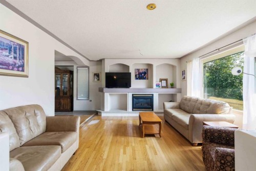 25 Crescent Heights, Fort Mcmurray, AB - Indoor Photo Showing Living Room With Fireplace