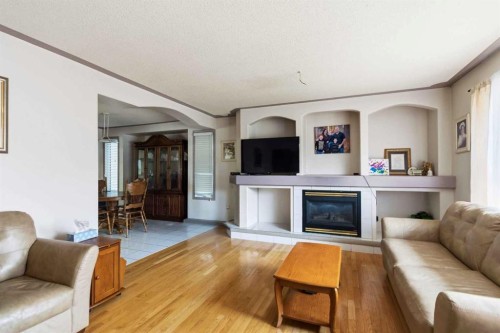 25 Crescent Heights, Fort Mcmurray, AB - Indoor Photo Showing Living Room With Fireplace
