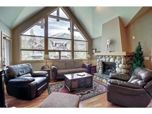 406-701 Benchlands Trail, Canmore, AB - Indoor Photo Showing Living Room With Fireplace