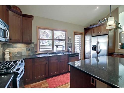 406-701 Benchlands Trail, Canmore, AB - Indoor Photo Showing Kitchen With Double Sink