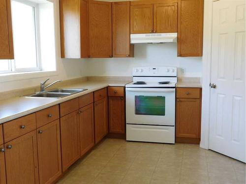 4917,4918,4919,4920 59 Street Close, Rocky Mountain House, AB - Indoor Photo Showing Kitchen With Double Sink