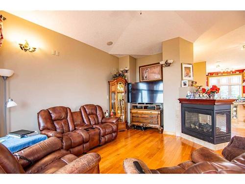 36075 Rr 281, Rural Red Deer County, AB - Indoor Photo Showing Living Room With Fireplace
