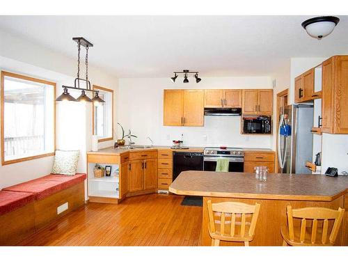 145-37411 Waskasoo Avenue, Rural Red Deer County, AB - Indoor Photo Showing Kitchen With Double Sink