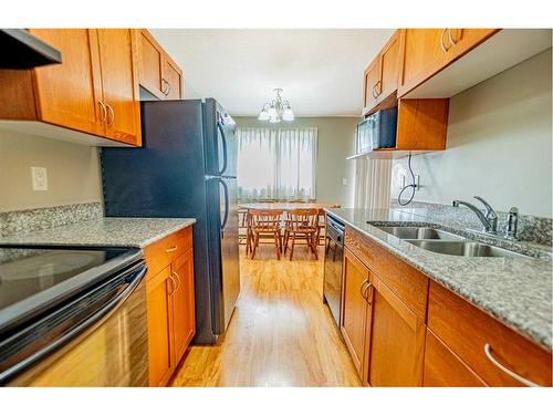 155-5140 62 Street, Red Deer, AB - Indoor Photo Showing Kitchen With Double Sink
