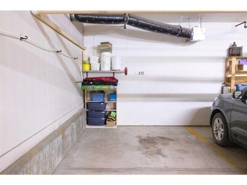 212-5020 49 Street, Rocky Mountain House, AB - Indoor Photo Showing Garage