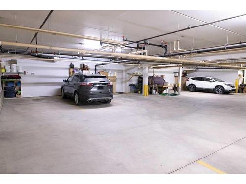212-5020 49 Street, Rocky Mountain House, AB - Indoor Photo Showing Garage