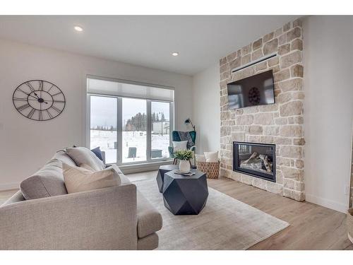 120 Emerald Drive, Red Deer, AB - Indoor Photo Showing Living Room With Fireplace