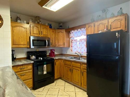 5207 49 Street, Ponoka, AB - Indoor Photo Showing Kitchen With Double Sink