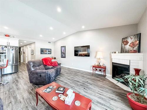 5011 C 49 Street, Stettler, AB - Indoor Photo Showing Living Room With Fireplace