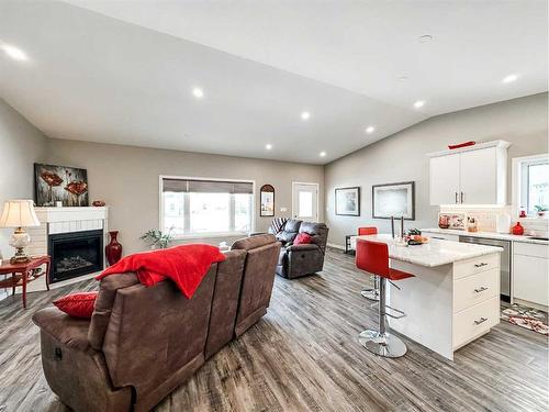 5011 C 49 Street, Stettler, AB - Indoor Photo Showing Living Room With Fireplace