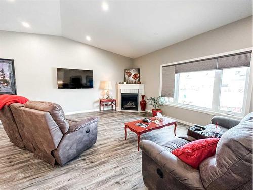 5011 C 49 Street, Stettler, AB - Indoor Photo Showing Living Room With Fireplace