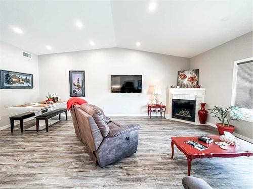 5011 C 49 Street, Stettler, AB - Indoor Photo Showing Living Room With Fireplace