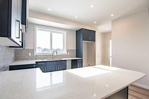 25 Lake Street, Rural Red Deer County, AB - Indoor Photo Showing Kitchen With Upgraded Kitchen