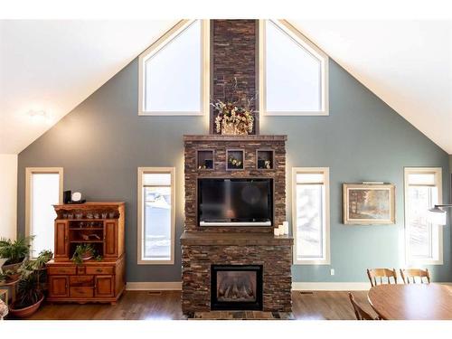 5761 51 Avenue, Innisfail, AB - Indoor Photo Showing Living Room With Fireplace
