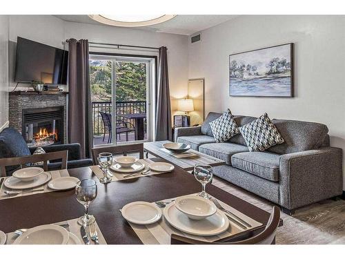 326-901 Mountain Street, Canmore, AB - Indoor Photo Showing Living Room With Fireplace