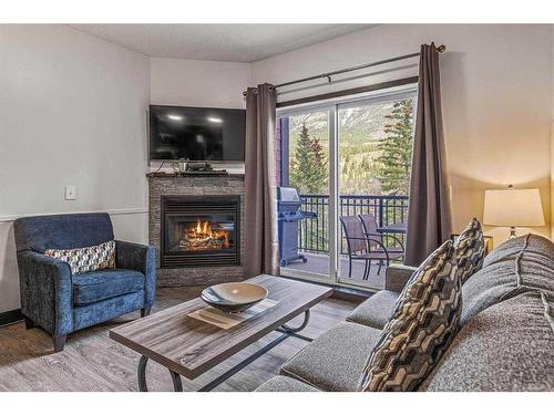 326-901 Mountain Street, Canmore, AB - Indoor Photo Showing Living Room With Fireplace