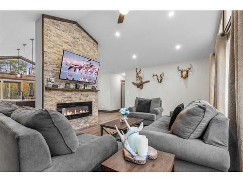 424021 Range Road 14A, Rural Ponoka County, AB - Indoor Photo Showing Living Room With Fireplace
