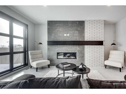 61 Thorkman Avenue, Red Deer, AB - Indoor Photo Showing Living Room With Fireplace