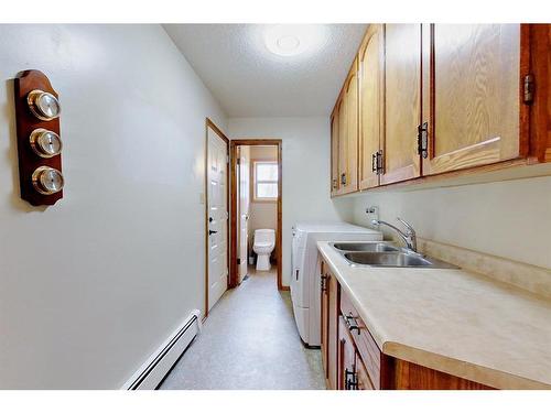 1323 596 Highway, Rural Red Deer County, AB - Indoor Photo Showing Kitchen With Double Sink