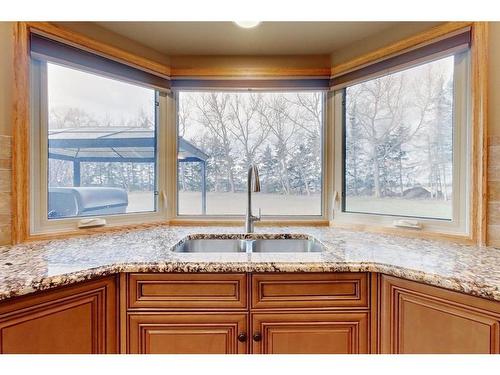 1323 596 Highway, Rural Red Deer County, AB - Indoor Photo Showing Kitchen With Double Sink
