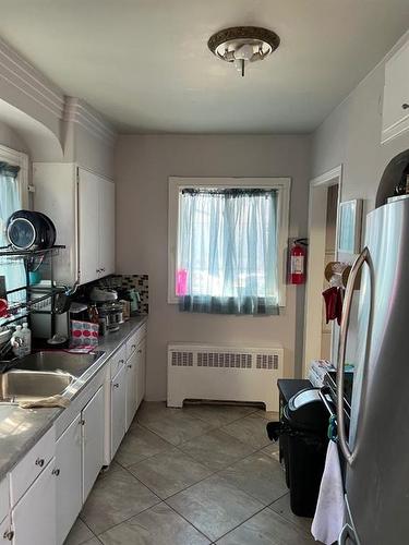 12105 79 Street, Edmonton, AB - Indoor Photo Showing Kitchen With Double Sink