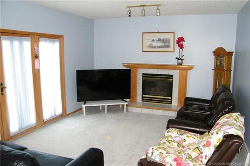 5606 46 Avenue West, Forestburg, AB - Indoor Photo Showing Living Room With Fireplace
