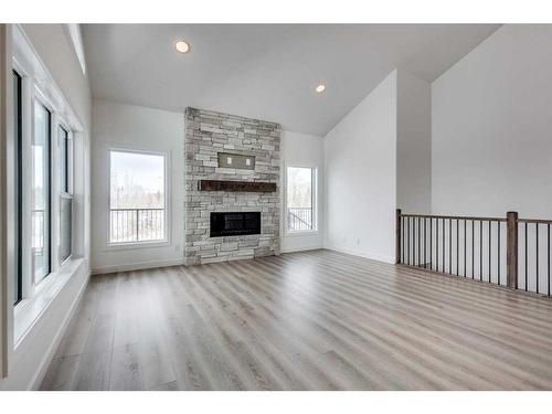 797 Springside Close, Rural Ponoka County, AB - Indoor Photo Showing Living Room With Fireplace