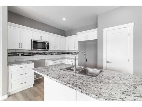 119 Livingston Close, Red Deer, AB - Indoor Photo Showing Kitchen With Double Sink With Upgraded Kitchen