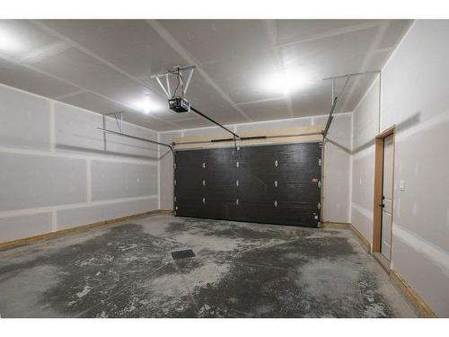 183 Cedar Square, Blackfalds, AB - Indoor Photo Showing Garage