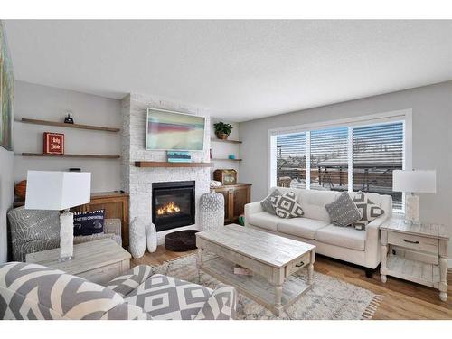 5813 45 Avenue Close, Rocky Mountain House, AB - Indoor Photo Showing Living Room With Fireplace