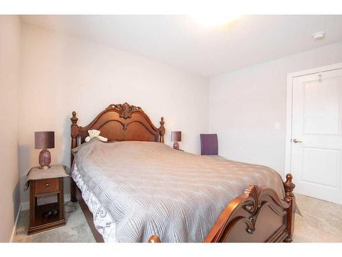 59 Iron Gate Boulevard, Sylvan Lake, AB - Indoor Photo Showing Bedroom