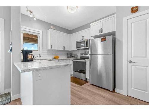59 Iron Gate Boulevard, Sylvan Lake, AB - Indoor Photo Showing Kitchen With Stainless Steel Kitchen