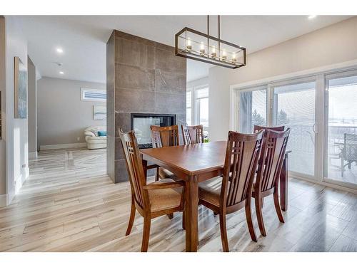 21 Longmire Close, Red Deer, AB - Indoor Photo Showing Dining Room With Fireplace