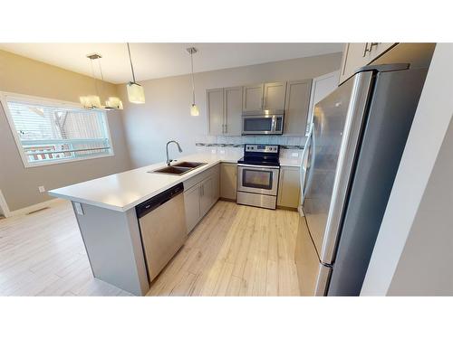 4320 Homestead Road, Lacombe, AB - Indoor Photo Showing Kitchen With Stainless Steel Kitchen With Double Sink