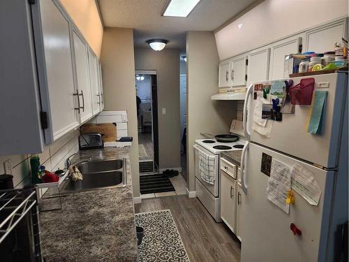 105-5812 61 Street, Red Deer, AB - Indoor Photo Showing Kitchen With Double Sink