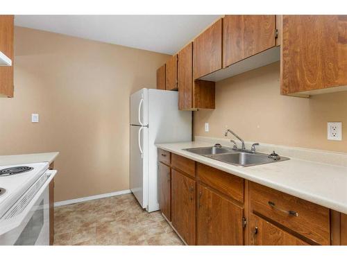 403-5418 52 Street, Camrose, AB - Indoor Photo Showing Kitchen With Double Sink