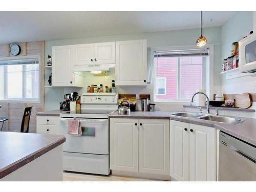 503-5220 50A  Ave, Sylvan Lake, AB - Indoor Photo Showing Kitchen With Double Sink